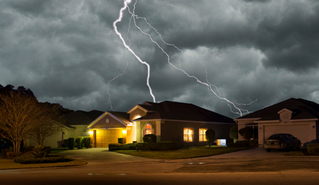 A home with power during an outage as lightning strikes in the background